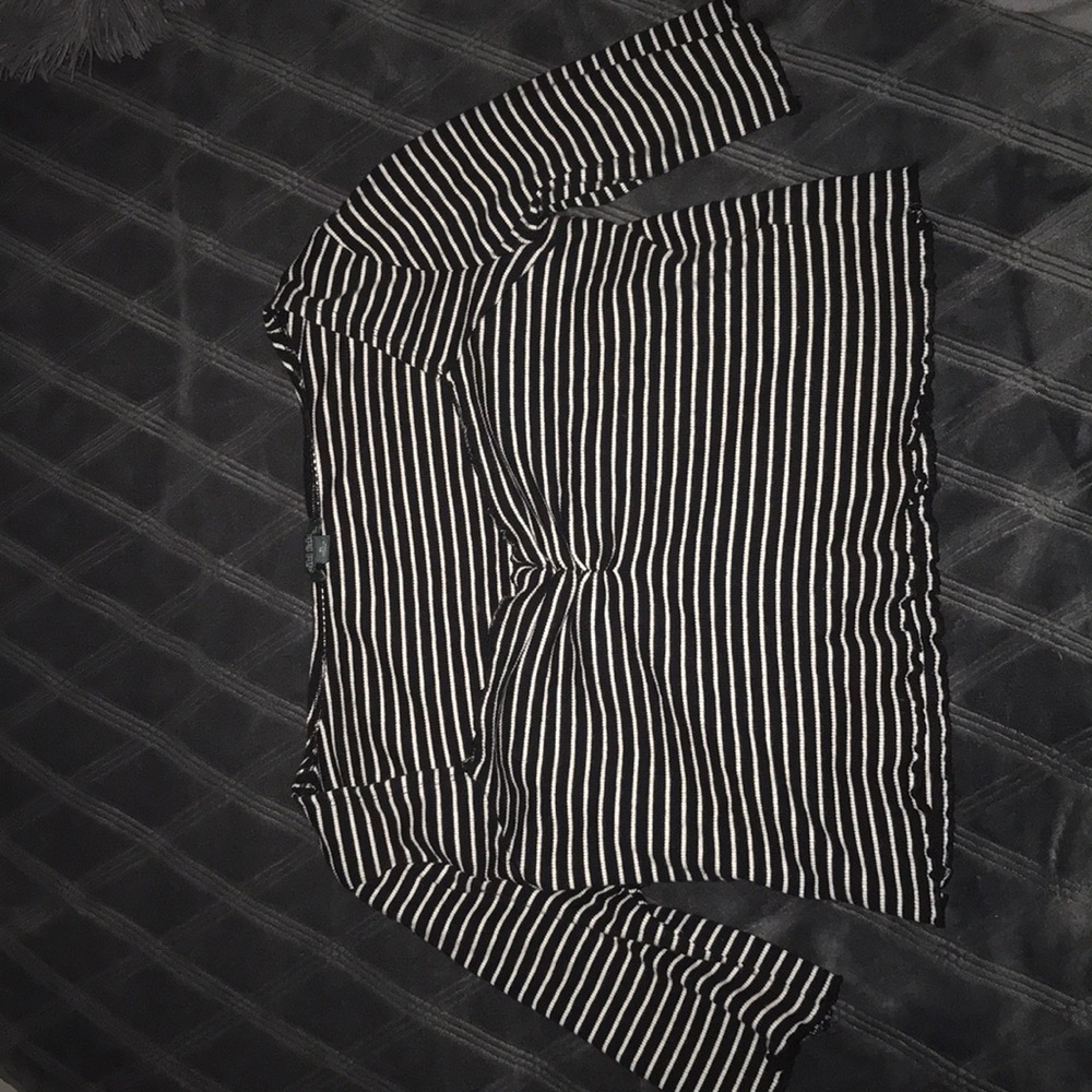 Black and white off the shoulder crop top shirt .